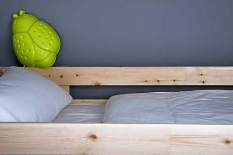 Bed in 8-Bed Dormitory Room with Shared Bathroom