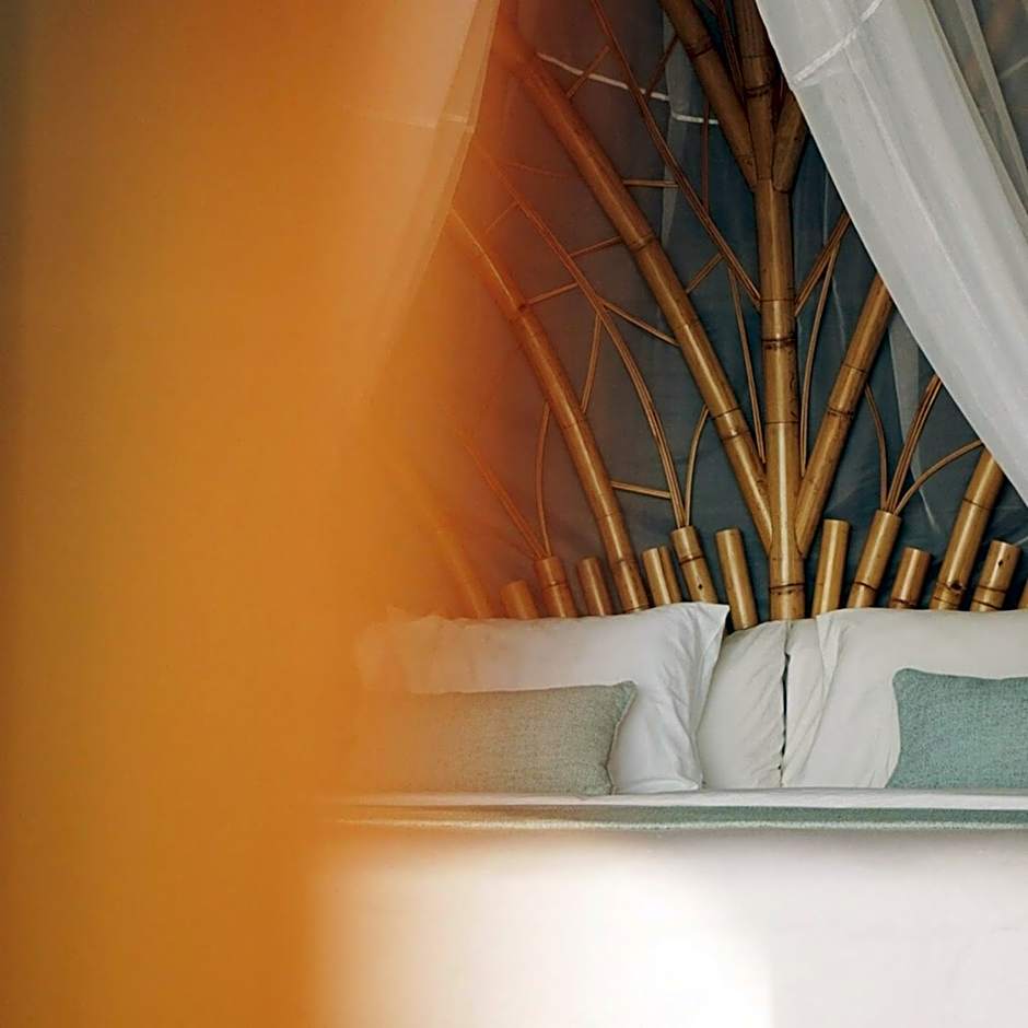 Kini Resort - Oceanfront Bamboo Eco Lodges