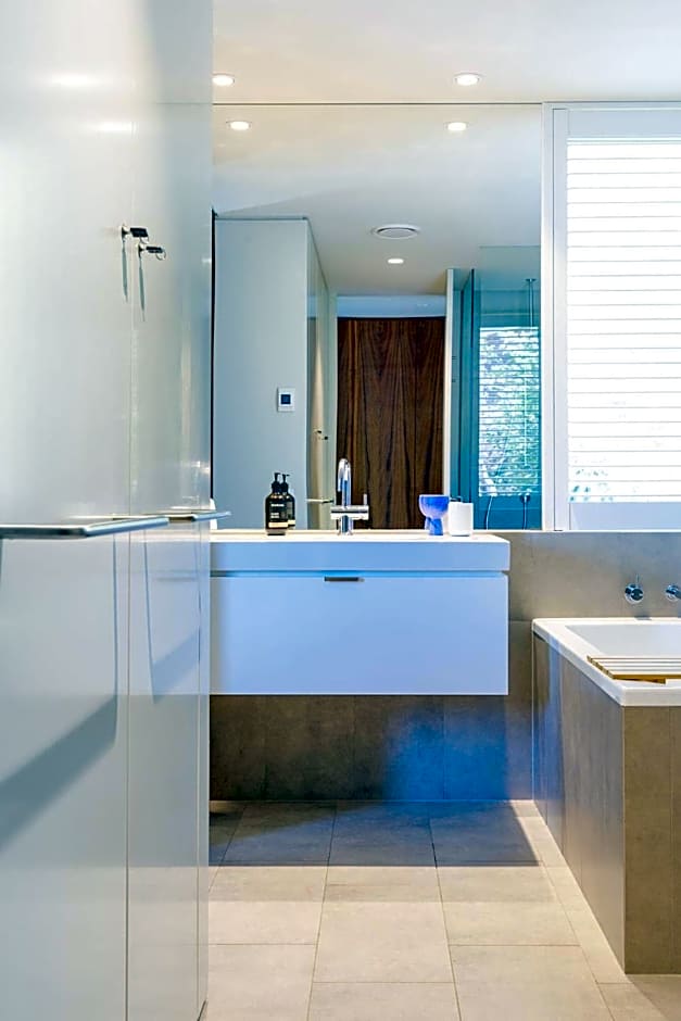 Architectural glass house with ocean views