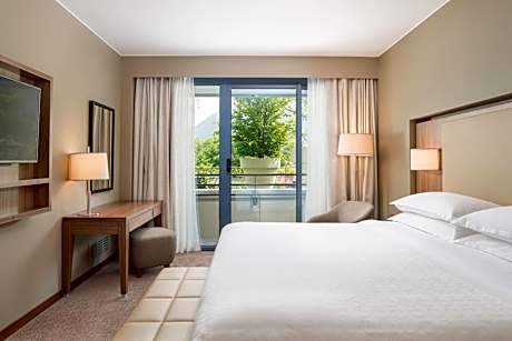 One-Bedroom King Suite with Sofa Bed, Balcony and Pool View
