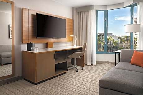 One Bedroom King Suite with Sofa, City View and Balcony