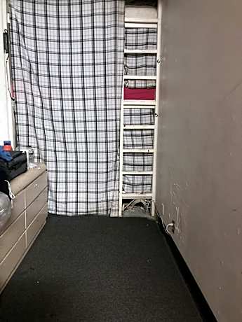 Single Bed in Dormitory Room