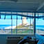 COUPLES GETAWAY, HONEYMOON SWEET, Perfectly Cozy Beach Front Condo with kitchen, pool, free parking,CHECK-IN AT DOOR