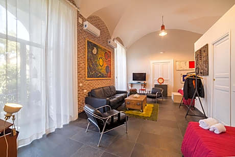 Suite with Balcony and Garden View