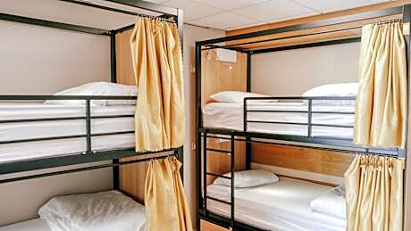 Bed in 4-Bed Female Dormitory Room with Shared Bathroom