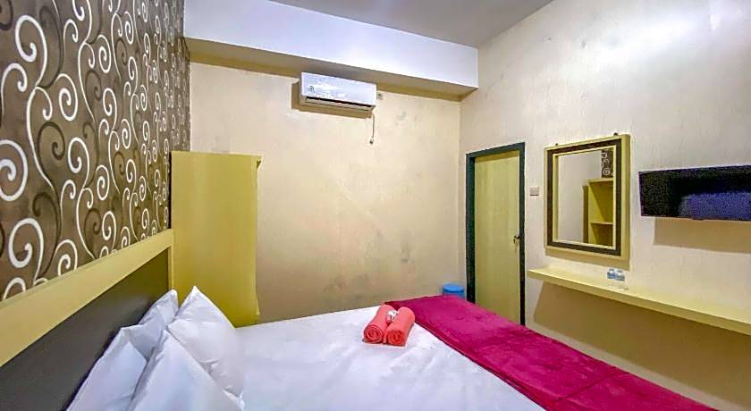 Tini's Guest House Malang Mitra RedDoorz