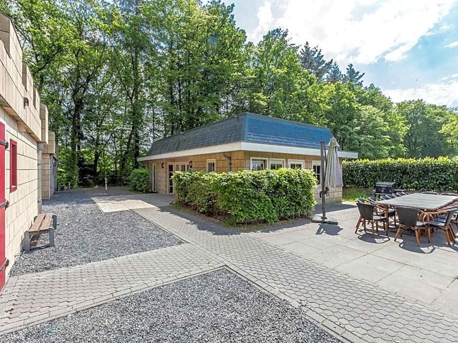 Designed home with bedstead, surrounded by forest