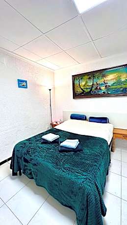 Quadruple Room with Private Bathroom