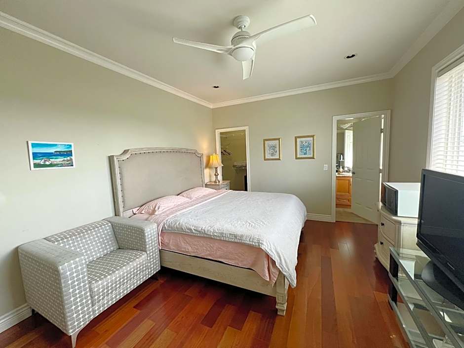 A cozy bedroom with a private washroom close to YVR Richmond