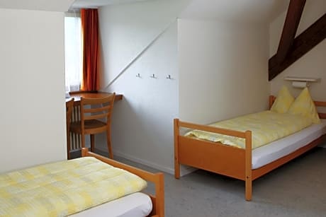 Single Bed in Female Dormitory Room