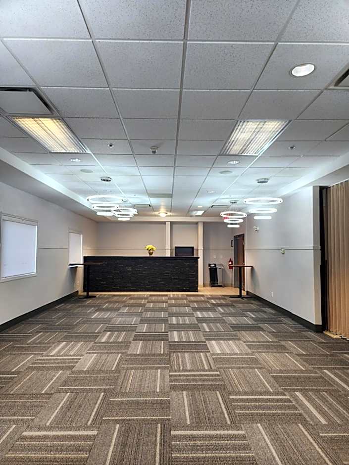 Merit Hotel & Suites