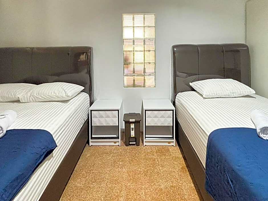 Tini's Guest House Malang Mitra RedDoorz