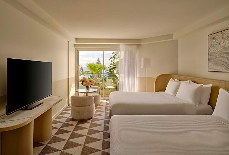 Photo 1 of 2 of Premium 2 Double Beds, Pool View