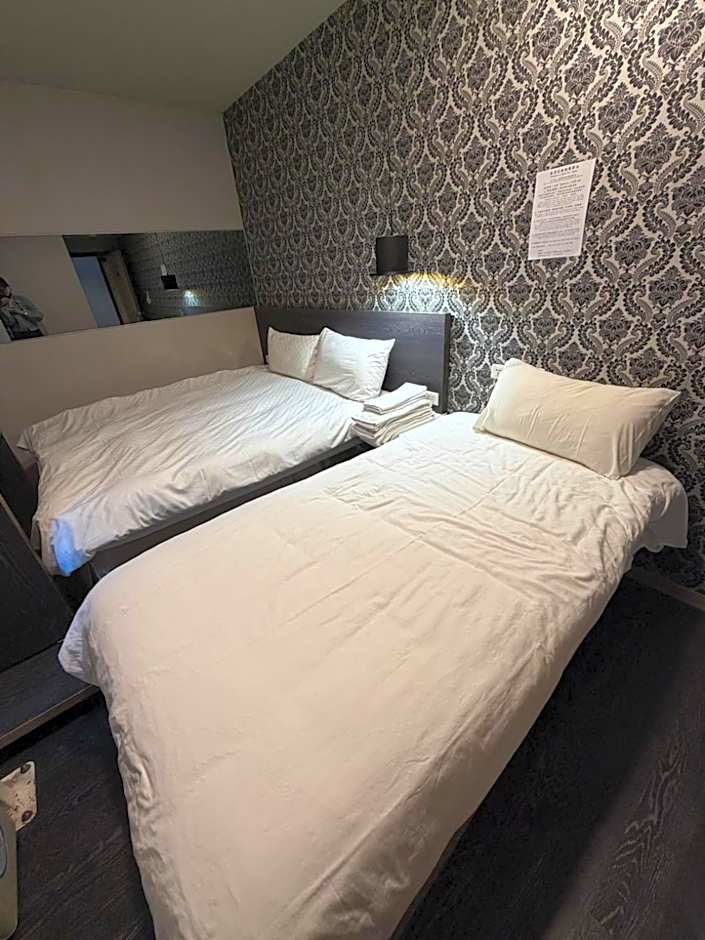 Photo 1 of 2 of Triple Room with Private Bathroom