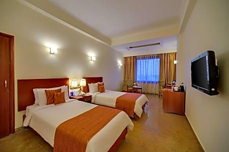 Superior Room 2 Twin Bed with Complimentary tea/coffee service for all our in-house guest at the poolside with some popular evening snacks of Siliguri from 5pm to 7pm