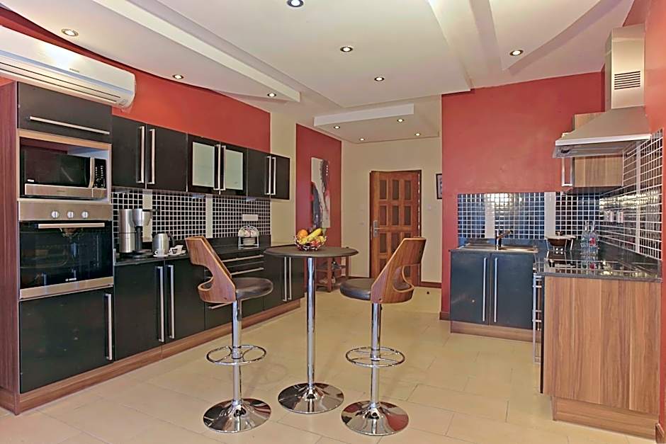 Cowrie Shell Beach Apartments Official