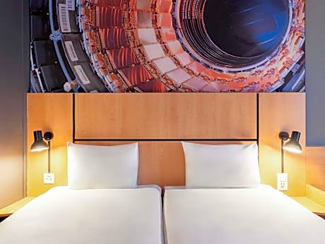 Room with twin beds (35x79"/90x200 cm) featuring the new bedding