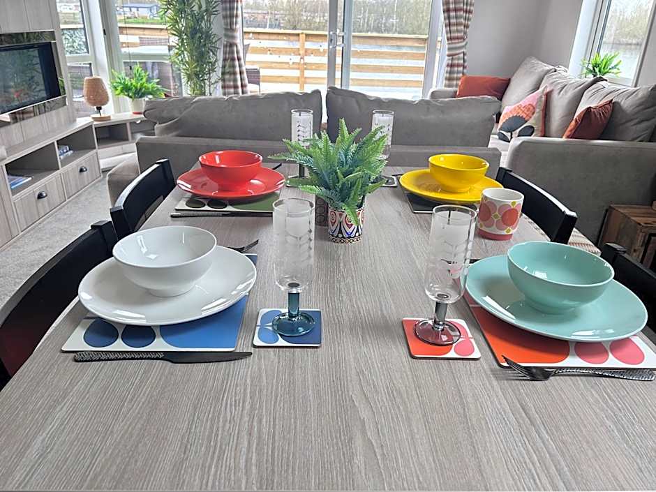 Award winning Serenity Lodge with outstanding lakeside views from the hot tub , at Tallington Lakes Leisure Park, Stamford