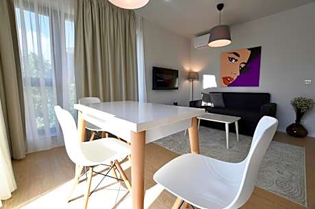 One-Bedroom Apartment with Balcony and City View