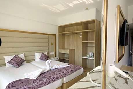 Double or Twin Room with Side Sea View (2 Adults + 1 Child)