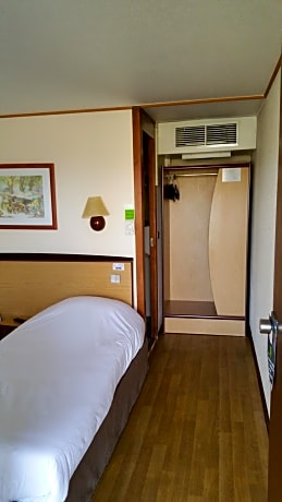 Twin Room with two single beds and one junior bed