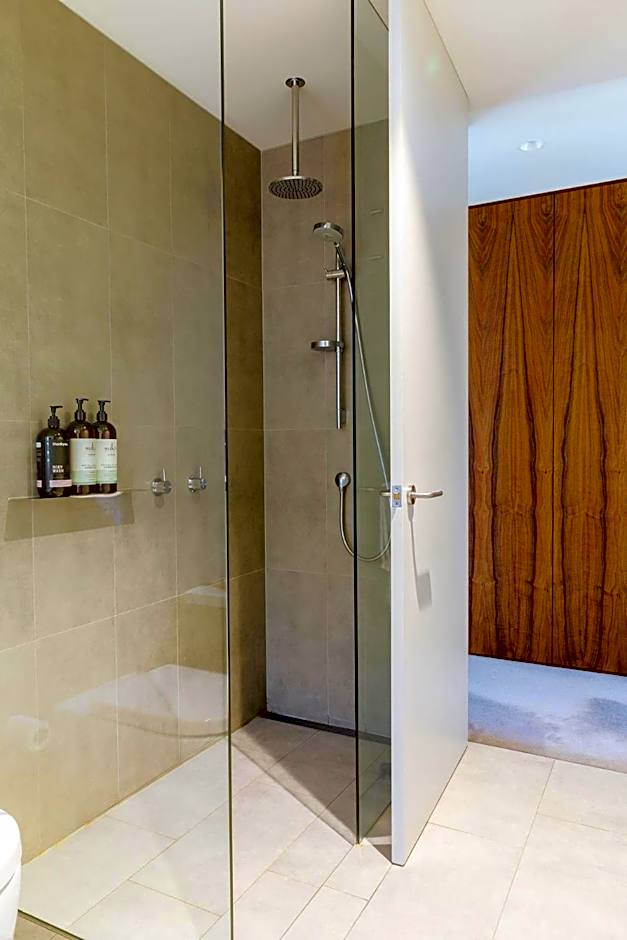 Architectural glass house with ocean views