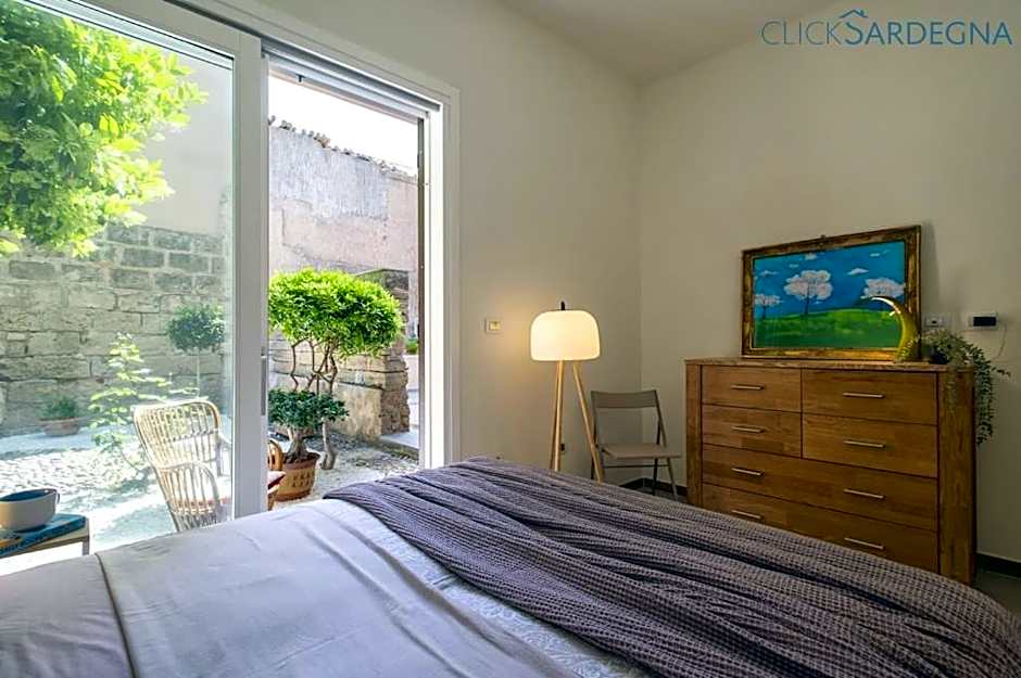 ClickSardinia Alghero Spectacular waterfront Neptune apartment with sea-facing terraces and garden