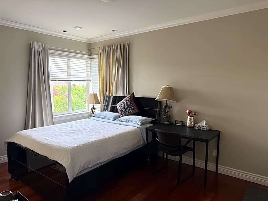 A quiet independent entrance suite on second floors with private bathroom close to YVR