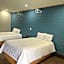 The Symphony Inn & Suites