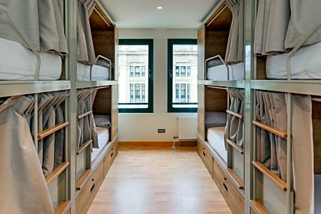 Bed in 8-Bed Dormitory Room with Shared Bathroom
