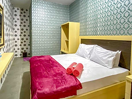 Tini's Guest House Malang Mitra RedDoorz