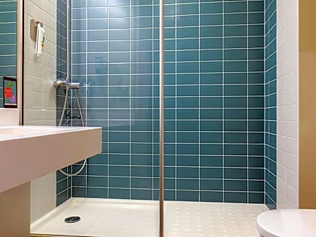 Standard Room with two single beds and a sofa