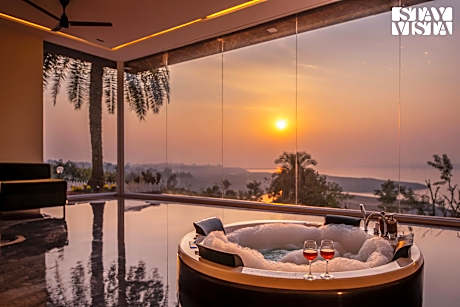 StayVista's Lake Pearl Serenity - Riverside, Mountain-View Villa with Jacuzzi, Sprawling Lawn & Terr