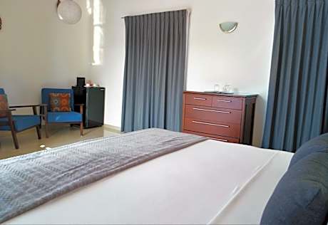 King Suite with Private Terrace and Pool View.