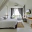 White Wall Riverfront Hotel