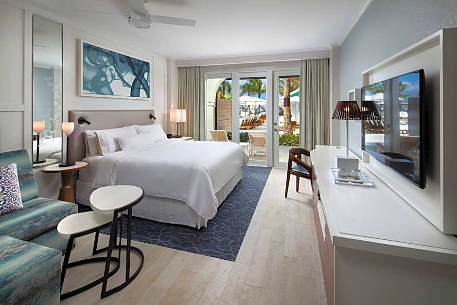 Photo 1 of 2 of 1 King Bed with Sofabed Guestroom, Poolside, Pool View, Lanai