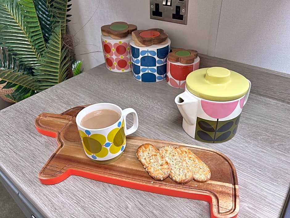 Award winning Serenity Lodge with outstanding lakeside views from the hot tub , at Tallington Lakes Leisure Park, Stamford