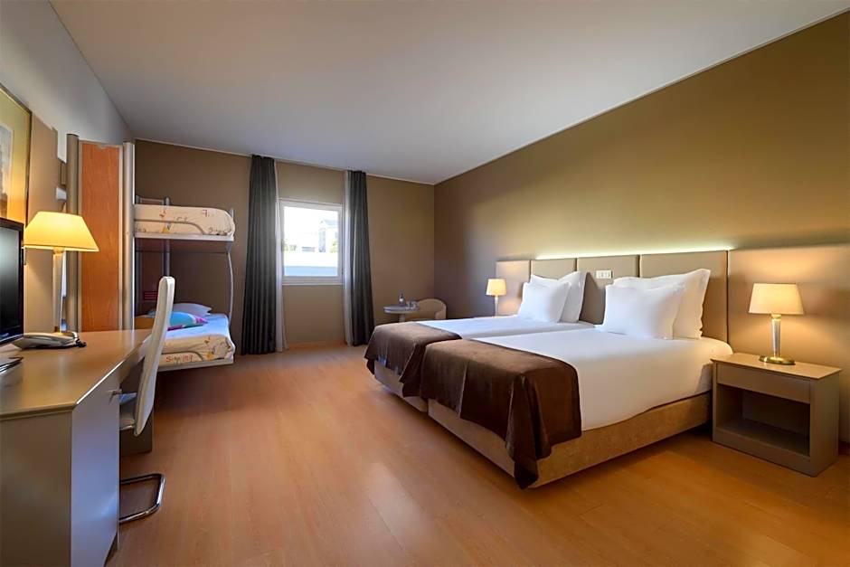 Photo 1 of 4 of Deluxe Family Room with Two Twin Beds and Bunk Bed - Non-Smoking