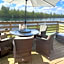 Award winning Serenity Lodge with outstanding lakeside views from the hot tub , at Tallington Lakes Leisure Park, Stamford