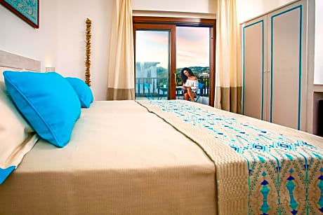 Junior Suite with Balcony and Pool View