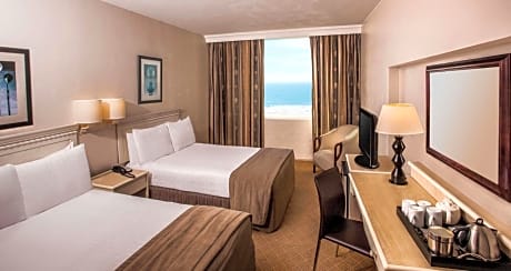 Standard Room with Two Double Beds and Partial Sea View