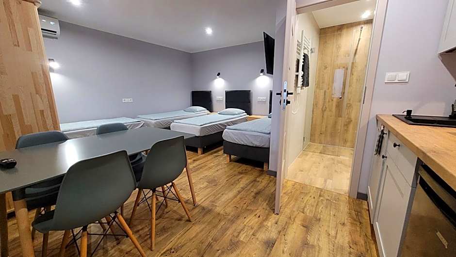 Wrzosowe Wzgórze 5 - Studia i Apartamenty