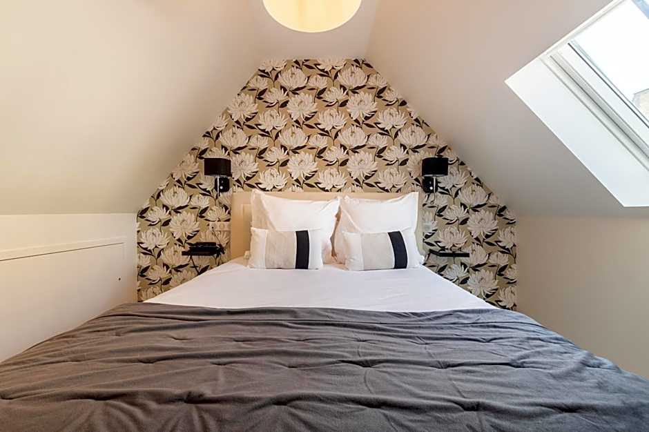 Hôtel Échappée en Baie - Parking privé gratuit dont forfaits bornes électriques réservable