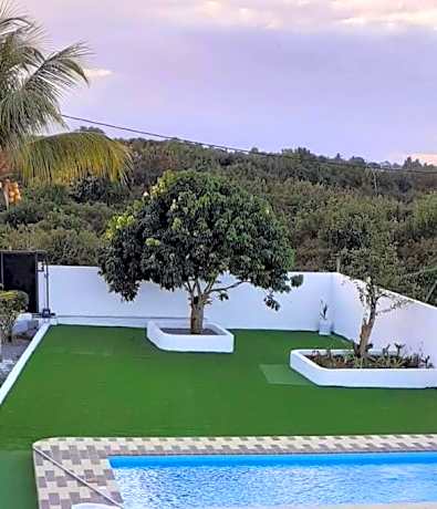 Villa Bella is 5 mins from the beach with amazing garden overlooking the pool