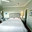 A cozy bedroom with a private washroom close to YVR Richmond