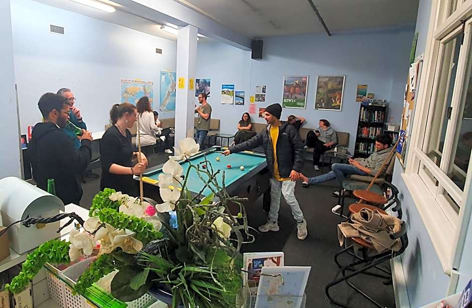 Surf 'N' Snow Backpackers Across Sky Tower