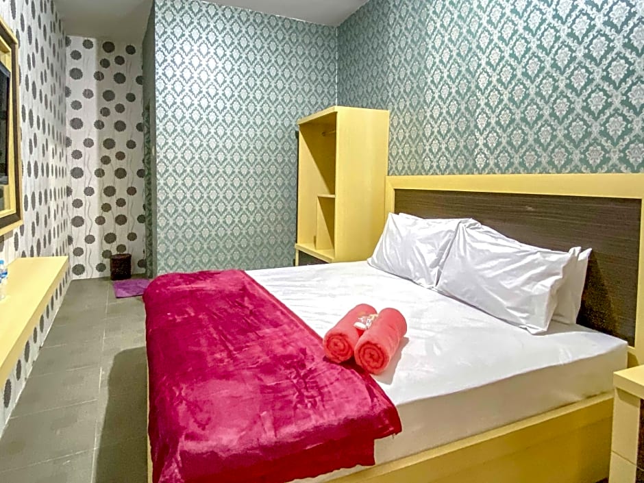 Tini's Guest House Malang Mitra RedDoorz