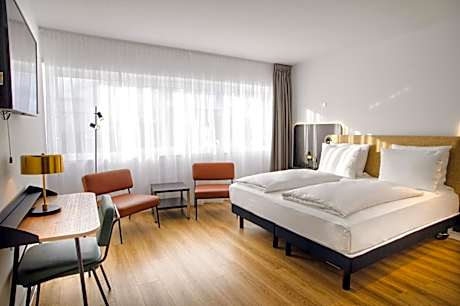 Junior Suite with Two Single Beds and One Sofa Bed