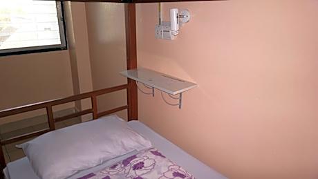 Bed in Dormitory Room with Air Conditioning