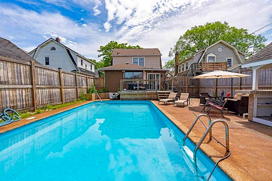vacation house with a heated pool and hot tub